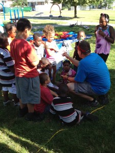 Joey Hamick of North Carolina sharing the Lord with children at the block party for Hope in Christ Assembly